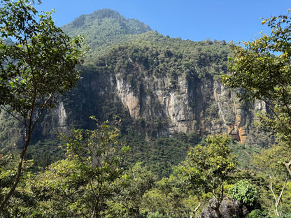 Mountain with greenery in the Huehuetenango region in Guatemala, under a clear blue sky